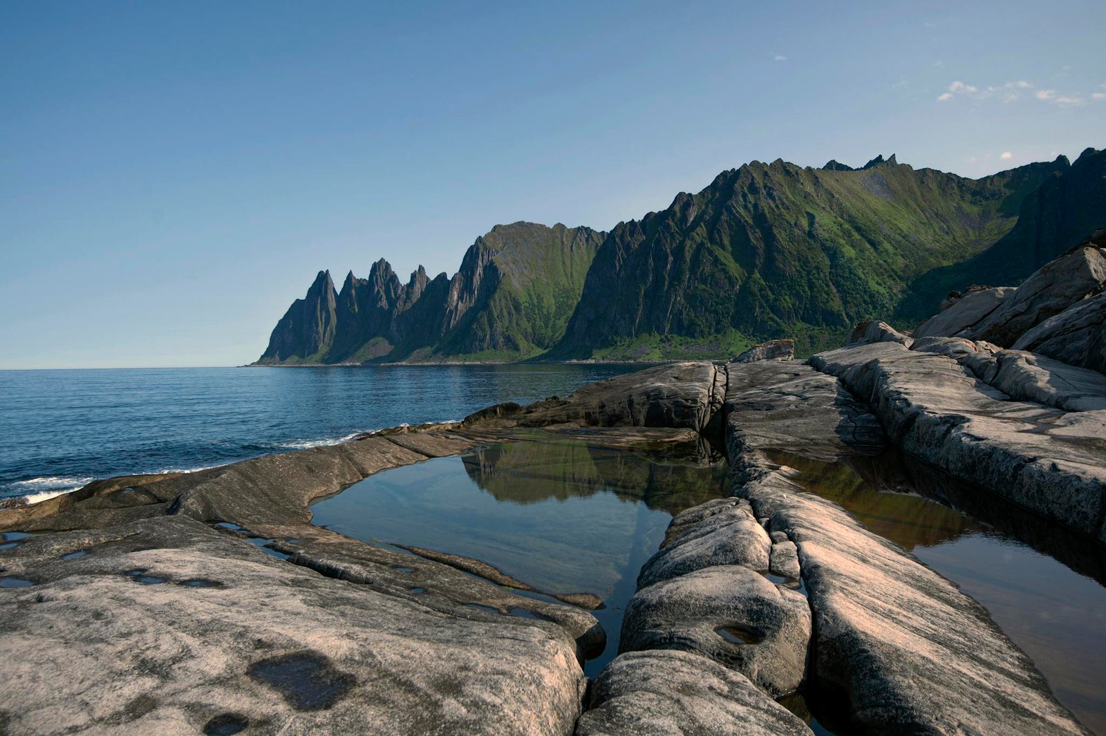 Scenic view of mountainous coastline and sea at Senjahopen, Norway.