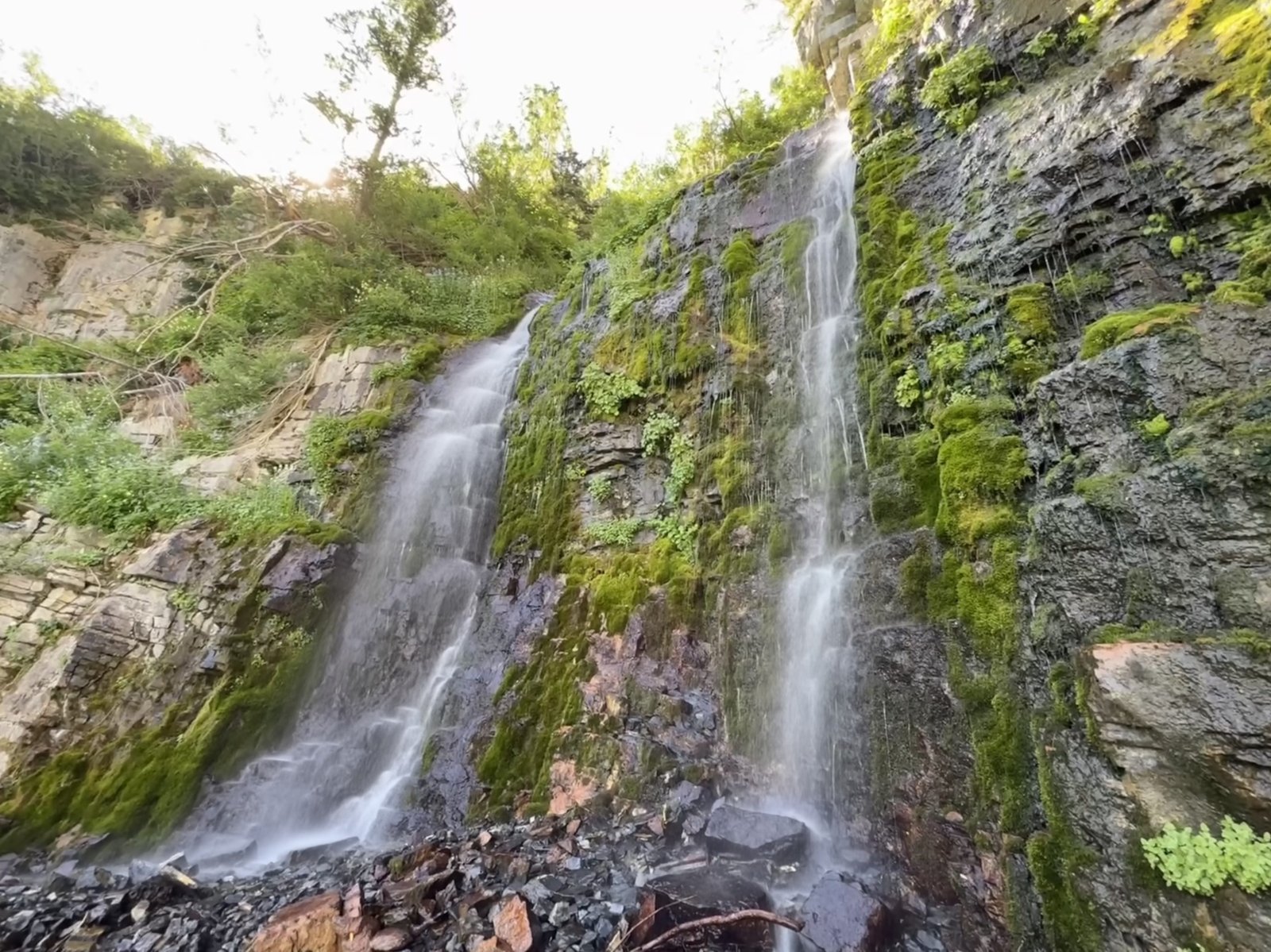 Scout Falls spilling down a rock face in American Fork Canyon